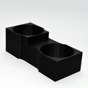 Suport de pahare cu 2 cavități, compatibil cu VW Golf 5 și Golf 6. Se montează în consola centrală, design precis, material durabil și aspect OEM.